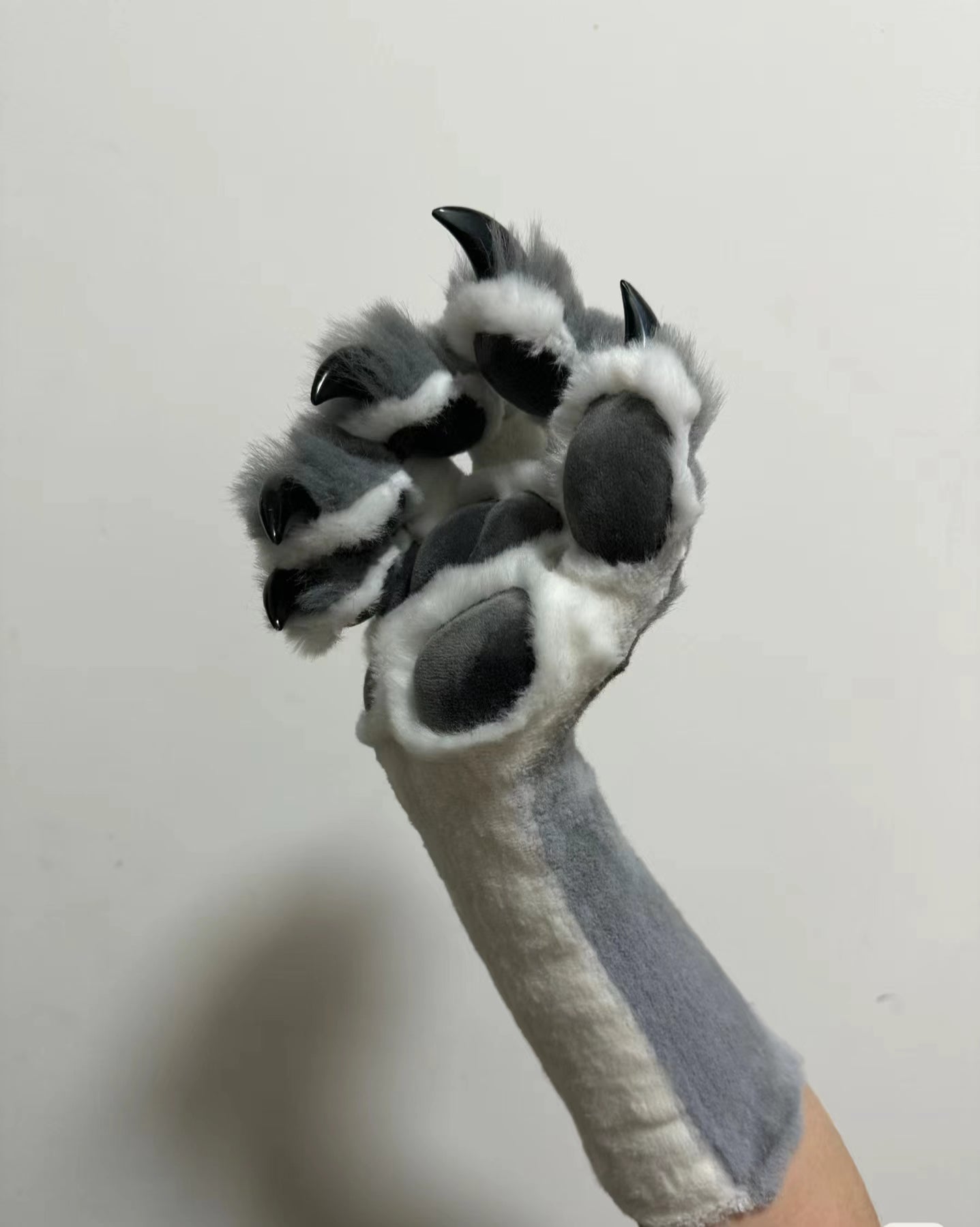 Dark gray & beige color-blocked faux fur with gray paw pads, realistic paws