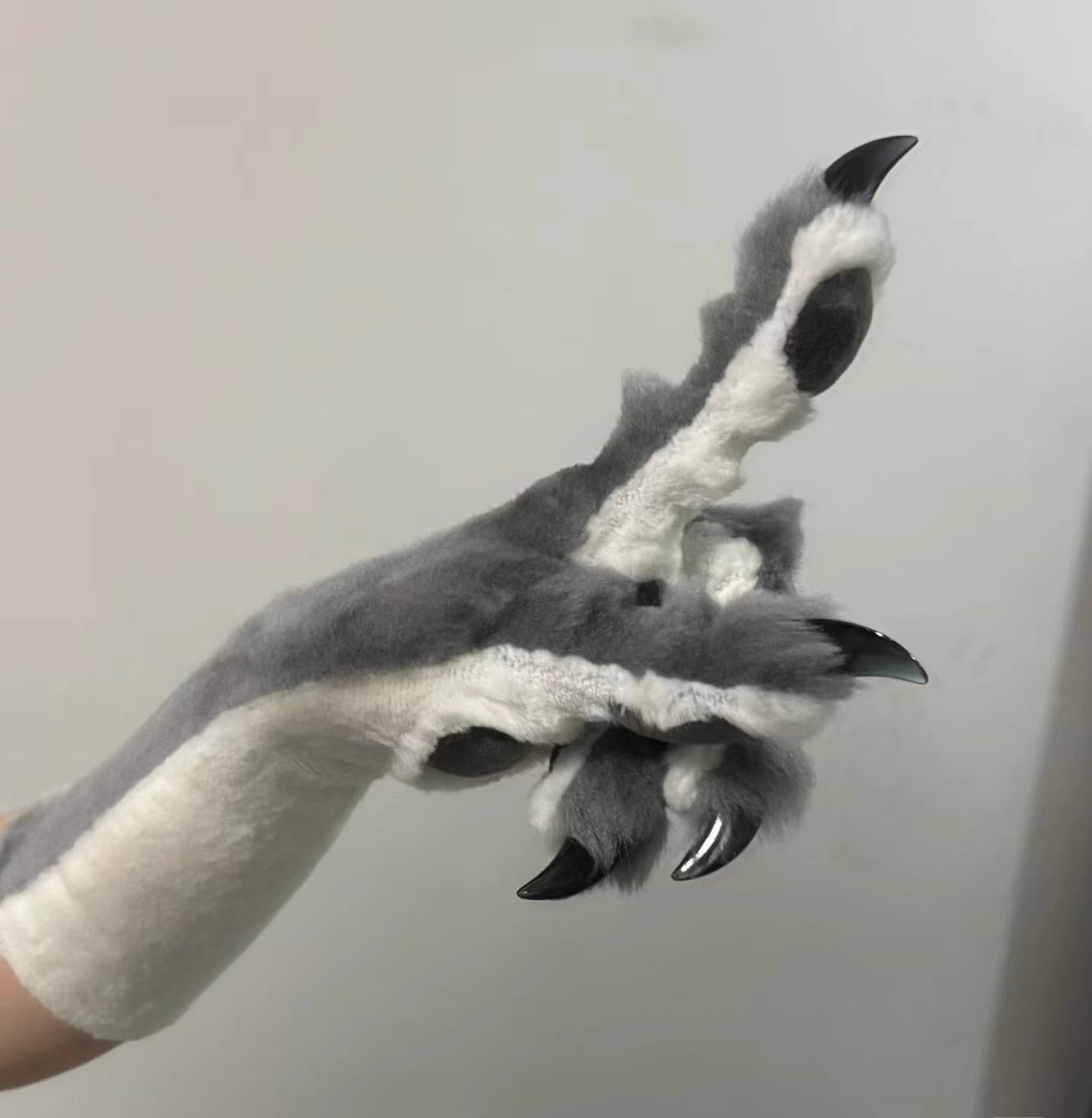 Dark gray & beige color-blocked faux fur with gray paw pads, realistic paws
