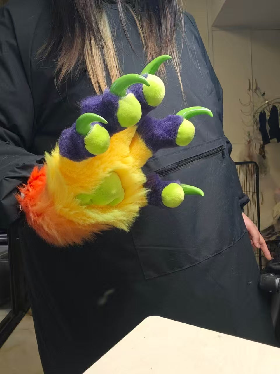 Purple, yellow, orange, and green color-blocked big claw; green 3D-printed nails furry fursuit