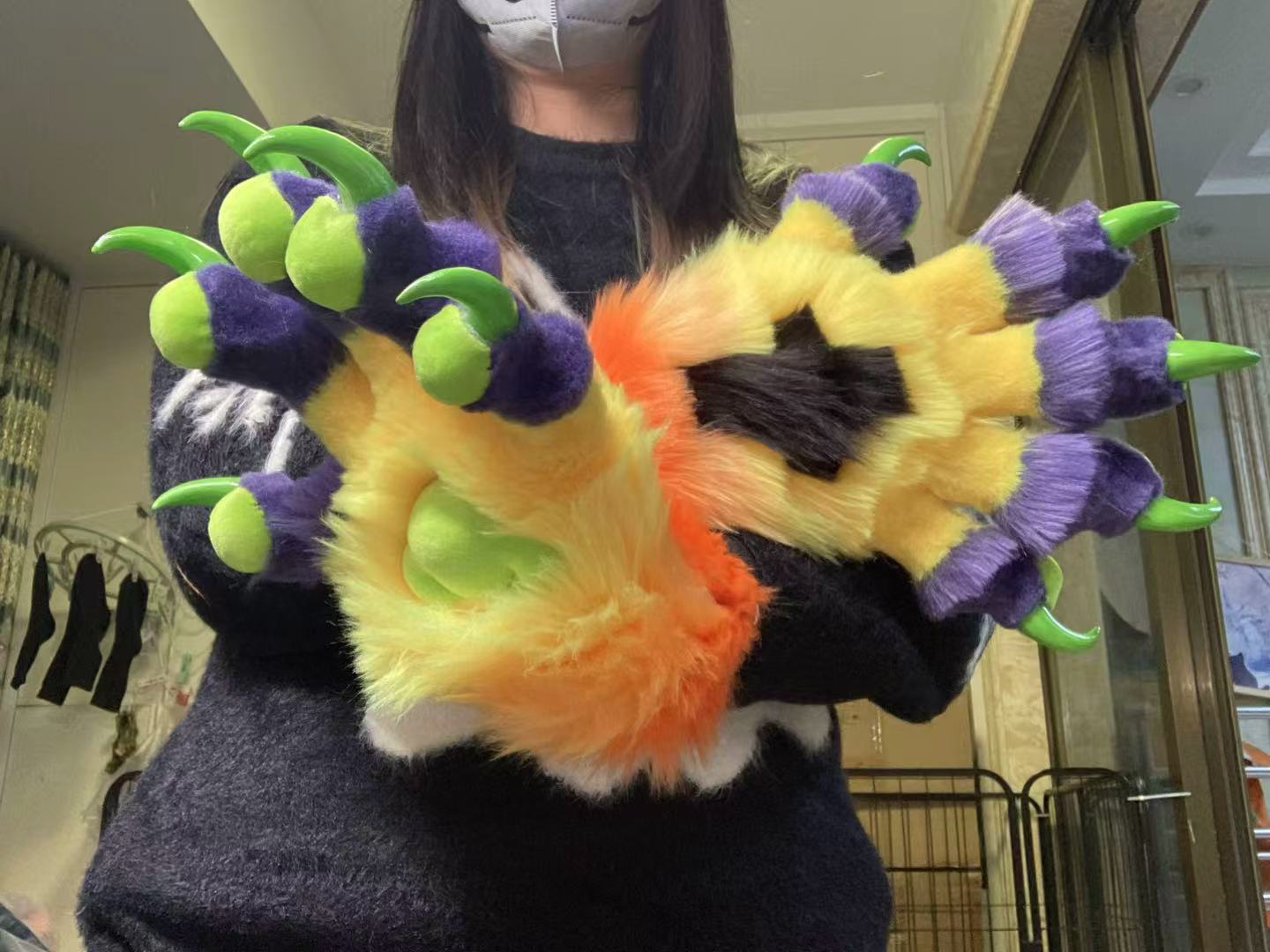 Purple, yellow, orange, and green color-blocked big claw; green 3D-printed nails furry fursuit