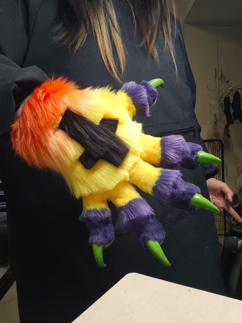 Purple, yellow, orange, and green color-blocked big claw; green 3D-printed nails furry fursuit