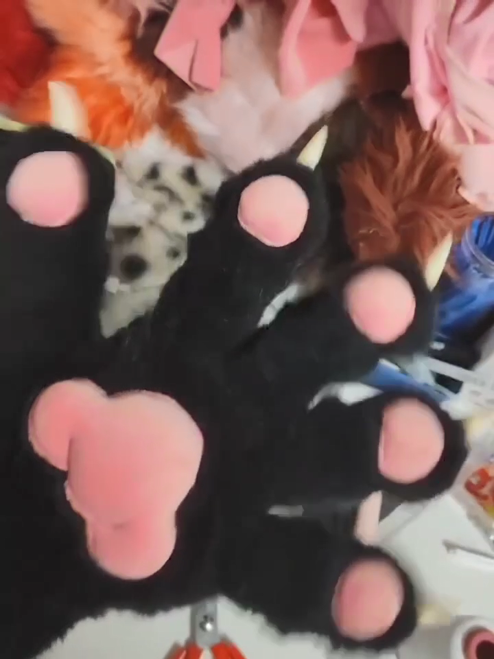 Black realistic paws  furry fursuit