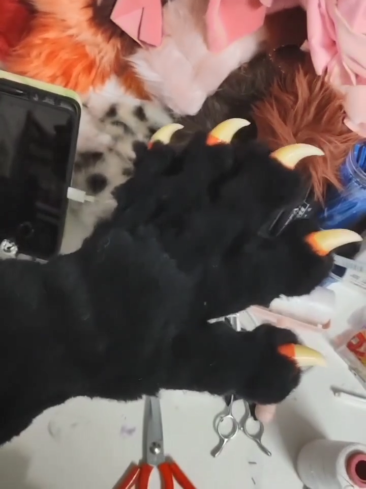 Black realistic paws  furry fursuit